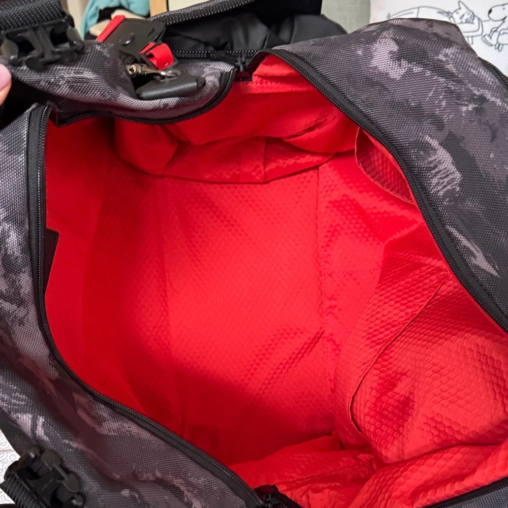 Tumi Black Camo Duffel Bag with Red Interior